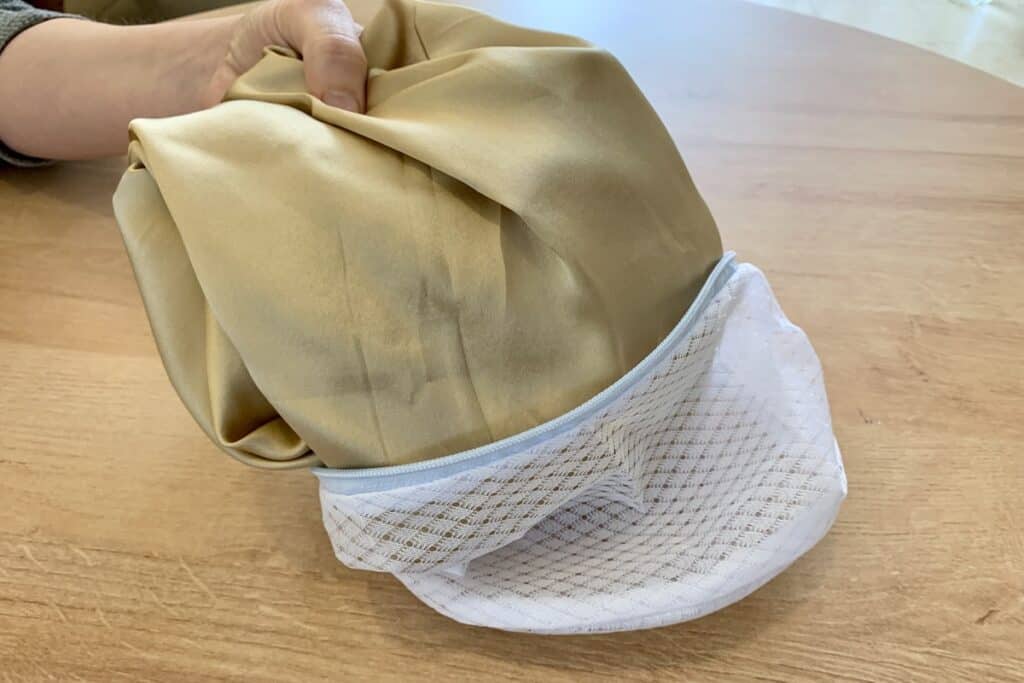 silk encasement in mesh laundry bag