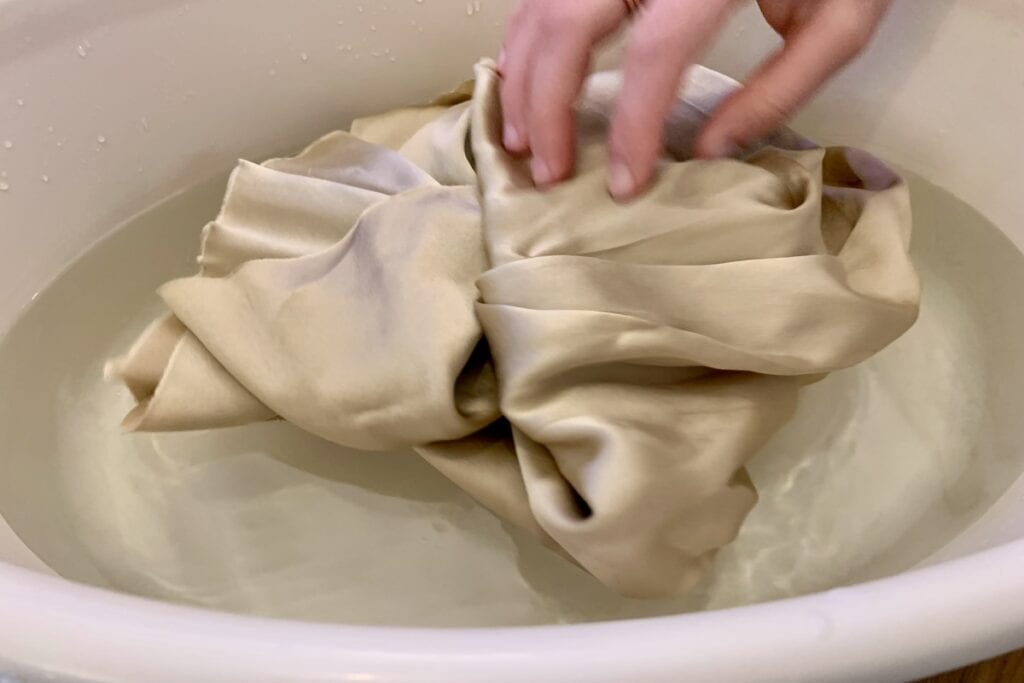 delicate soaking of beige silk fabric