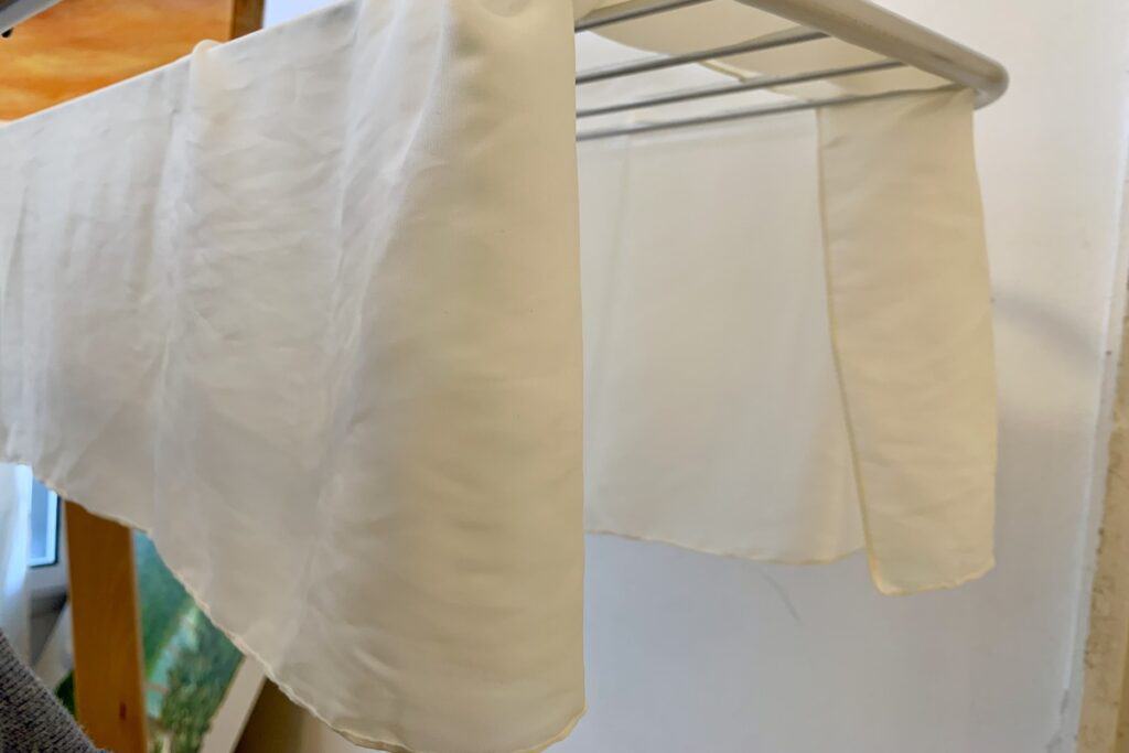 shade drying white silk scarf